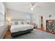 King bedroom with white bedding, nightstands, and a seating area at 3019 Brownell Ave, Sullivans Island, SC 29482