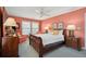 Bright bedroom with a sleigh bed and wood nightstands at 3019 Brownell Ave, Sullivans Island, SC 29482