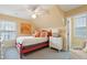Bedroom with red bed frame, dresser and window seat at 3019 Brownell Ave, Sullivans Island, SC 29482