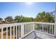 White deck overlooking the backyard and neighborhood at 3019 Brownell Ave, Sullivans Island, SC 29482