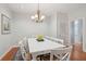 Bright dining room with white table, chairs, and hardwood floors at 3019 Brownell Ave, Sullivans Island, SC 29482