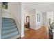 Entryway with hardwood floors and staircase leading upstairs at 3019 Brownell Ave, Sullivans Island, SC 29482