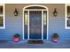 Dark gray front door with arched window and sidelights at 3019 Brownell Ave, Sullivans Island, SC 29482