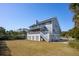 Gray house with a screened porch and a detached garage at 3019 Brownell Ave, Sullivans Island, SC 29482