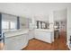 Open kitchen with white cabinets, stainless steel appliances and breakfast bar at 3019 Brownell Ave, Sullivans Island, SC 29482