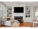 Cozy living area with fireplace, built-in shelving, and comfortable seating at 3019 Brownell Ave, Sullivans Island, SC 29482