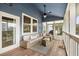 Relaxing screened porch with wicker furniture and ceiling fan at 3019 Brownell Ave, Sullivans Island, SC 29482