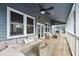 Large screened porch perfect for relaxing with outdoor furniture at 3019 Brownell Ave, Sullivans Island, SC 29482