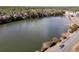 Aerial view of a serene lake and road, highlighting the community's natural surroundings at 3038 Fraserburgh Way # 2200, Mount Pleasant, SC 29466