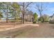 Backyard with mature trees and a view of a golf course, highlighting outdoor space and scenery at 3038 Fraserburgh Way # 2200, Mount Pleasant, SC 29466