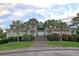 Community clubhouse with palm trees and landscaping, highlighting amenities and social spaces at 3038 Fraserburgh Way # 2200, Mount Pleasant, SC 29466