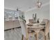 Elegant dining area with a wooden table, four chairs and view of living room at 3038 Fraserburgh Way # 2200, Mount Pleasant, SC 29466
