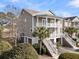 Two-story home with light gray siding, white trim, and a double-door entrance at 3038 Fraserburgh Way # 2200, Mount Pleasant, SC 29466