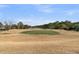 Golf course with rolling hills and lush green fairways, highlighting recreational amenities at 3038 Fraserburgh Way # 2200, Mount Pleasant, SC 29466