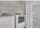 Bright laundry room, featuring washer, dryer and shelving at 3038 Fraserburgh Way # 2200, Mount Pleasant, SC 29466