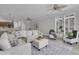 Open living space featuring a sectional sofa and large windows with plantation shutters at 3038 Fraserburgh Way # 2200, Mount Pleasant, SC 29466