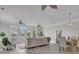 Open concept living and dining area with large windows and hardwood floors at 3038 Fraserburgh Way # 2200, Mount Pleasant, SC 29466