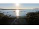 Aerial view of waterway, bridge, and boats at sunset at 310 Longshore St # 645, Daniel Island, SC 29492