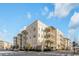 Modern apartment building with balconies and ample parking at 310 Longshore St # 645, Daniel Island, SC 29492