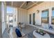 Spacious balcony with wicker furniture and outdoor seating at 310 Longshore St # 645, Daniel Island, SC 29492