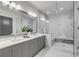 Modern bathroom with double vanity and a large walk-in shower at 310 Longshore St # 645, Daniel Island, SC 29492