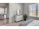 Well-lit bedroom with a dresser, and a view of the living room at 310 Longshore St # 645, Daniel Island, SC 29492