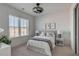 Comfortable bedroom featuring a cozy bed and large window at 310 Longshore St # 645, Daniel Island, SC 29492