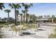 Relax in this charming community plaza with tables and palm trees at 310 Longshore St # 645, Daniel Island, SC 29492