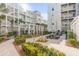 Community courtyard with pergola, seating, and landscaping at 310 Longshore St # 645, Daniel Island, SC 29492
