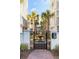 Gated courtyard entrance with fountain and palm trees at 310 Longshore St # 645, Daniel Island, SC 29492