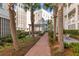 Brick-paved courtyard pathway with lush landscaping at 310 Longshore St # 645, Daniel Island, SC 29492