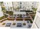 Relaxing courtyard with seating areas, fountains, and lush landscaping at 310 Longshore St # 645, Daniel Island, SC 29492