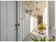 Bright hallway with ceiling fan and access to unit at 310 Longshore St # 645, Daniel Island, SC 29492