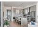 Modern kitchen with gray island and stainless steel appliances at 310 Longshore St # 645, Daniel Island, SC 29492