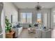 Bright living room with white slipcovered furniture and hardwood floors at 310 Longshore St # 645, Daniel Island, SC 29492
