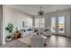 Bright living room with white slipcovered furniture and hardwood floors at 310 Longshore St # 645, Daniel Island, SC 29492