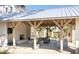 Relaxing outdoor kitchen area with fireplace and seating at 310 Longshore St # 645, Daniel Island, SC 29492