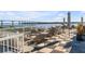 Rooftop deck with water views, comfortable seating, and umbrellas at 310 Longshore St # 645, Daniel Island, SC 29492