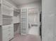 Spacious walk-in closet with built-in shelves and drawers at 310 Longshore St # 645, Daniel Island, SC 29492
