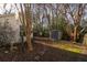 Private backyard with storage shed and mature trees at 359 Muirfield Pkwy, Charleston, SC 29414