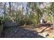 Fenced backyard with mature trees and storage shed at 359 Muirfield Pkwy, Charleston, SC 29414