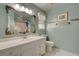 Clean bathroom with white vanity and decorative mirror at 359 Muirfield Pkwy, Charleston, SC 29414