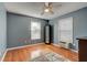 Bright bedroom with hardwood floors and two windows at 359 Muirfield Pkwy, Charleston, SC 29414