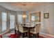 Bright dining room with a wooden table and six chairs at 359 Muirfield Pkwy, Charleston, SC 29414