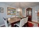 Spacious dining room, hardwood floors, and a formal dining setting at 359 Muirfield Pkwy, Charleston, SC 29414