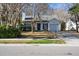 White house with a black front door and a landscaped yard at 359 Muirfield Pkwy, Charleston, SC 29414