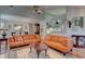 Spacious living room with orange leather sofas and hardwood floors at 359 Muirfield Pkwy, Charleston, SC 29414