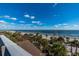 Stunning aerial view of beachfront property with palm trees at 367 Pelican Flight Dr, Dewees Island, SC 29451