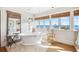 Relaxing bathroom with a soaking tub and ocean views at 367 Pelican Flight Dr, Dewees Island, SC 29451