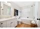 Charming bathroom with a soaking tub and natural light at 367 Pelican Flight Dr, Dewees Island, SC 29451